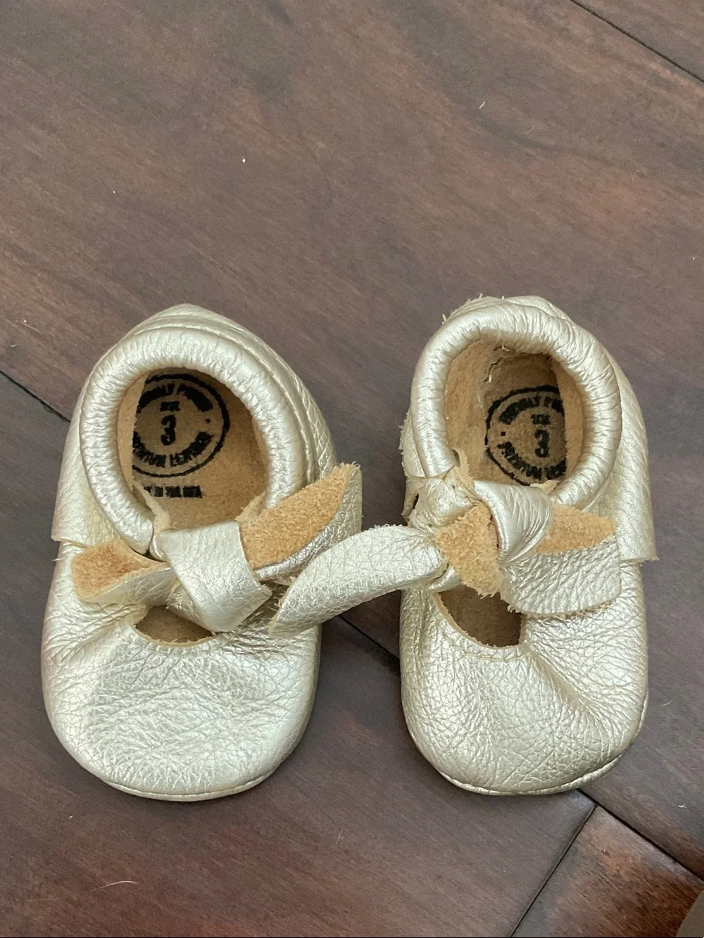 Freshly Picked Metallic Gold Bow Moccasins